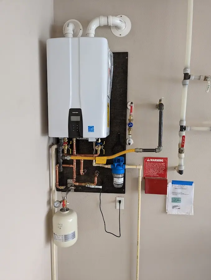 Professional plumber installing copper piping in a Delray Beach home